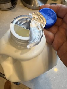 A milk jug with a double lepel seal