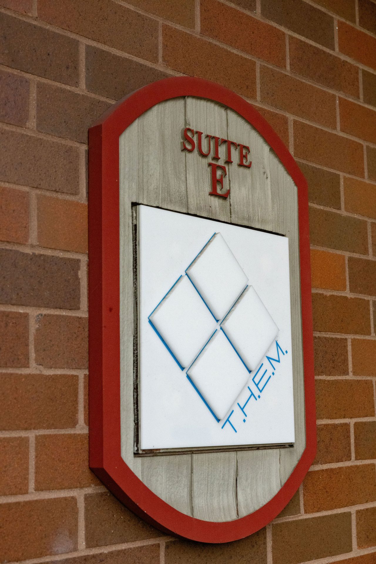 Them_logo_facility_sign